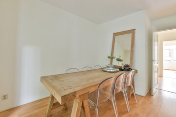 Minimalist dining room interior with rustic wooden table