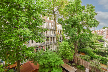 Urban green space with residential buildings and lush foliage