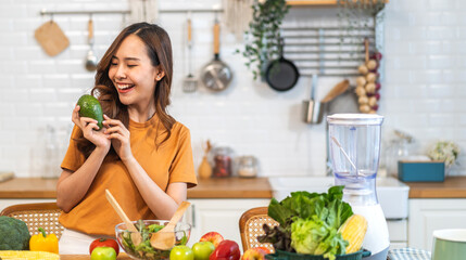 Portrait of beauty health asian woman having fun hold avocado cooking, vegan food healthy eat,...