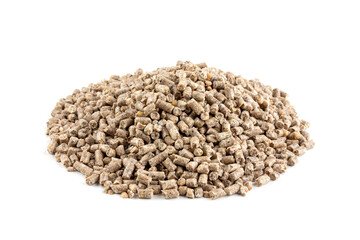a pile of compound feed for feeding animals and poultry isolated on a white background close-up