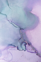 Abstract aerial view of fluid art with pastel colors showcasing purple and turquoise hues blending seamlessly at sunset