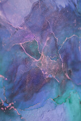 Abstract blue and green marbled texture with gold accents showcasing flowing patterns and vibrant hues