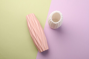 Minimalistic vases in Scandinavian style on pastel background. Top view