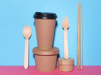 Eco containers for takeaway food on a blue pink background