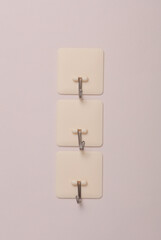 Wall hooks on a beige background