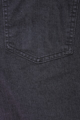 Fototapeta premium Back pocket of dark gray jeans