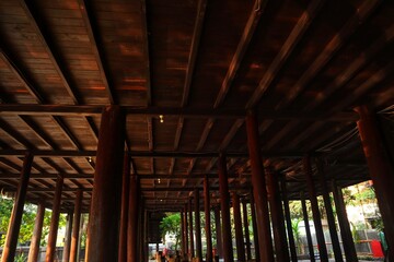 Wooden pillars of a traditional stilt house.
