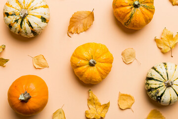 Autumn composition. Pattern made of dried leaves and other design accessories on table. Flat lay, top view
