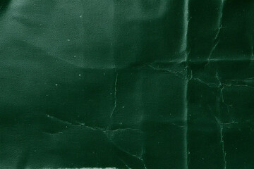Obraz premium Dark Green Folded Paper Texture, Dark Green Paper with Deep Folds, Textured Dark Green Folded Surface, Dark Folded Paper Texture for Background