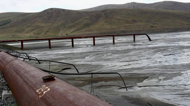 dumping waste into the river
