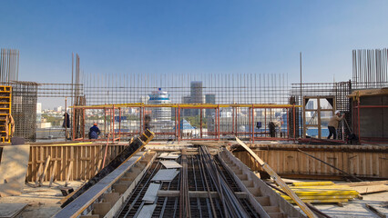 Construction workers working on steel rods used to reinforce concrete timelapse