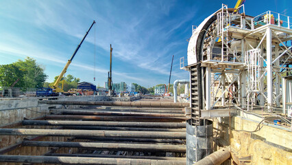 Huge ditch pit at the construction site of the underground metro station line timelapse.