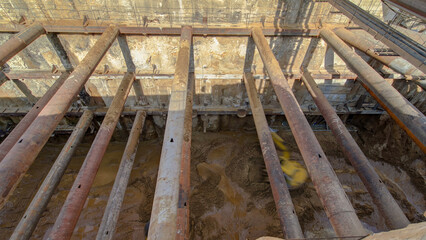 Huge ditch pit at the construction site of the underground metro station line timelapse.