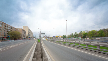 Naklejka premium Traffic jams of roadside, transportation motion in a big city. Rush hour traffic on a city roads timelapse.
