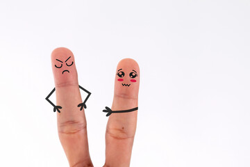 A pair of fingers in conflict, one with a sad face and the other with an angry face