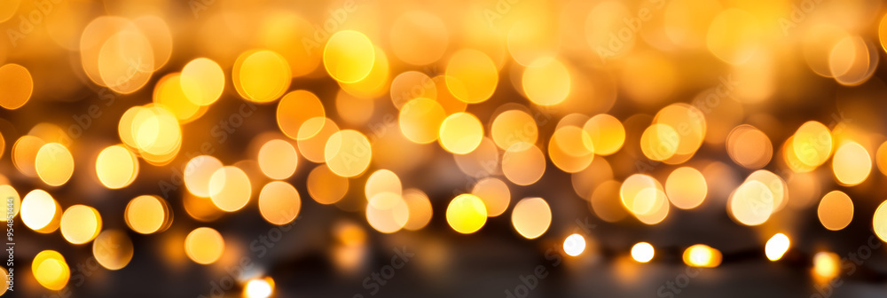 Poster soft focus abstract background with warm blur bokeh lights in shades of orange and yellow creating a