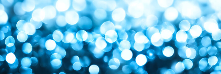 Obraz premium Subtle abstract background with cool toned blur bokeh lights in icy blues and whites softly fading into each other 