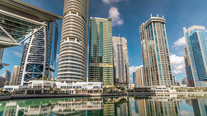 Obraz premium Residential buildings in Jumeirah Lake Towers timelapse in Dubai, UAE.