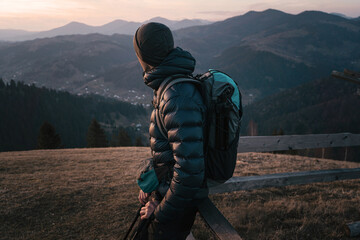 Hiker Resting with Scenic Mountain View at Sunset