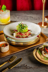 a woman eating luxurious avocado salad 