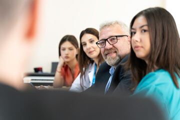 Group of Medical Team and Business People Meeting in Hospital and Office Conference Room