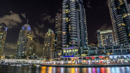 Obraz premium Dubai Marina towers and canal in Dubai night timelapse hyperlapse