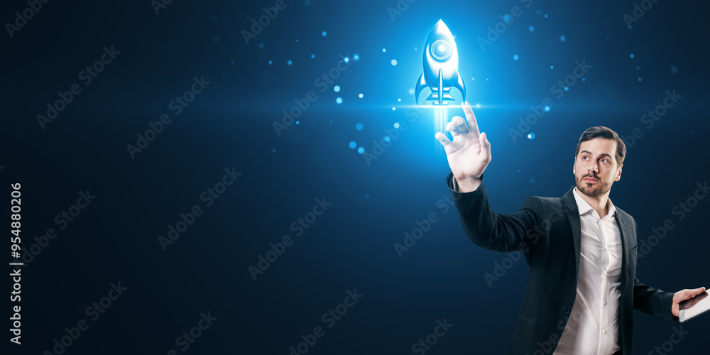 Poster attractive young european businessman with tablet using creative glowing rocket spaceship hologram o