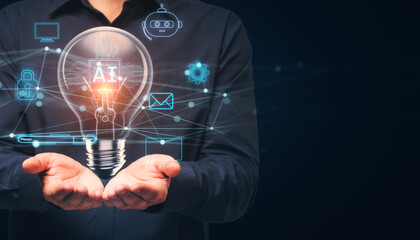 Close up of businessman hand holding glowing ai lamp on dark blue background. Mock up place. Artificial intelligence and future innovations concept.