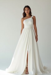 Fototapeta premium Diagonal portrait of a Mexican woman in a contemporary white couture dress, exuding elegance and sophistication. Perfect for fashion editorials and lookbooks.