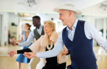 Men and women swing dancers flicking