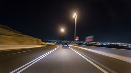 Obraz premium Curvy road through the Jebel Hafeet road timelapse hyperlapse, Al Ain, United Arab Emirates