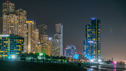 Naklejka premium Modern skyscrapers night timelapse in Jumeirah beach residence in Dubai, JBR