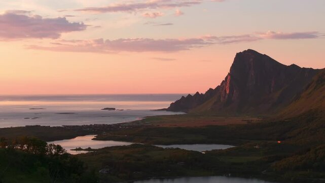 Arctic Vester&aring;len Bleik village in vivid pink midnight sun sunset glow; reveal