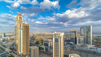 Dubai skyscrapers timelapse evening sunset time. Dubai Metro station and traffic on Sheikh Zayed Road