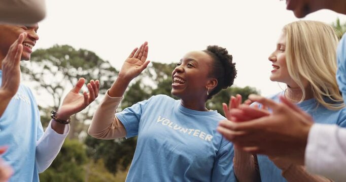 Applause, charity and volunteers in outdoor park with friends for outreach group program. Happy, clapping hands and ngo team cheering for community service partnership in nature for sustainability.