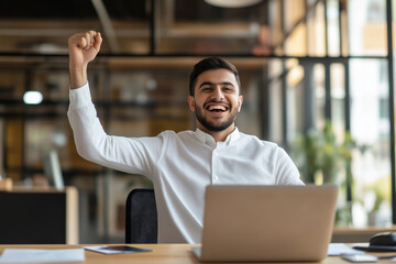 Fototapeta premium Joyful celebration of success in an office setting during the morning hours