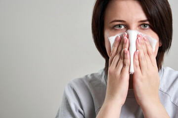 Young woman holding gauze or bandage instead of medical face mask to protect from coronavirus....