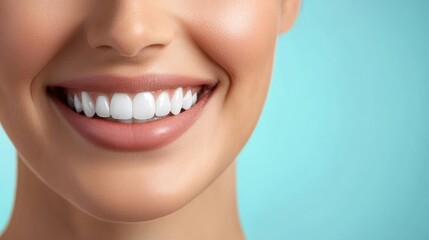 Obraz premium A detailed image of a woman's radiant smile with perfectly aligned white teeth, set against a soft light blue background.