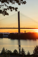Obraz premium Port Mann Bridge. Port Mann Bridge over Fraser River at sunset. Vancouver, BC, Canada. Bridges and structures.