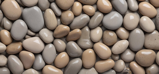 Gray pebbles, wet pebbles, sea stones, beautiful pebbles, top view 
