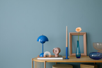 Contemporary interior styling with a blend of colorful and modern decor, including a unique vase...