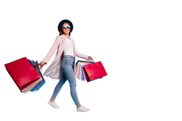 Full size photo of cute pretty cheerful lady in eyeglasses eyewear go shopping for bargains wear season cote denim jeans isolated over blue background