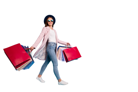 Full size photo of cute pretty cheerful lady in eyeglasses eyewear go shopping for bargains wear season cote denim jeans isolated over blue background - Powered by Adobe
