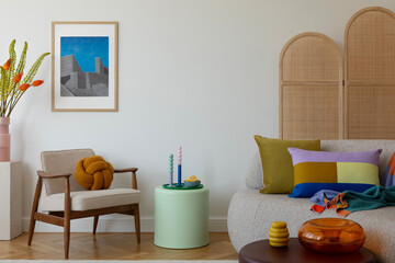 Stylish living room with a mid-century modern chair, colorful pillows, and a unique knot cushion,...