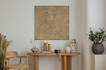 A boho console table adorned with earthy-toned decor pieces, including candles and a ceramic vase. The abstract mock up wall art adds a touch of sophistication to this elegant space.