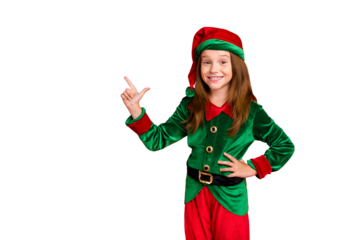 Portrait of lovely child elf in hat showing her finger point at ads recommend party wearing green elf costume hat cap isolated over red background