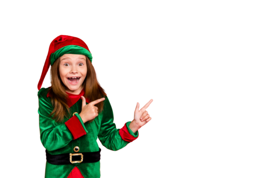 Portrait of impressed funky elf in hat cap showing ads with her index fingers screaming wow omg see magic wearing green costume isolated over red background