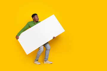 Photo of funny male carry large smart phone new model device black friday prices buyer isolated...