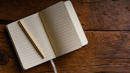 Notepad and Pen on a Wooden Surface