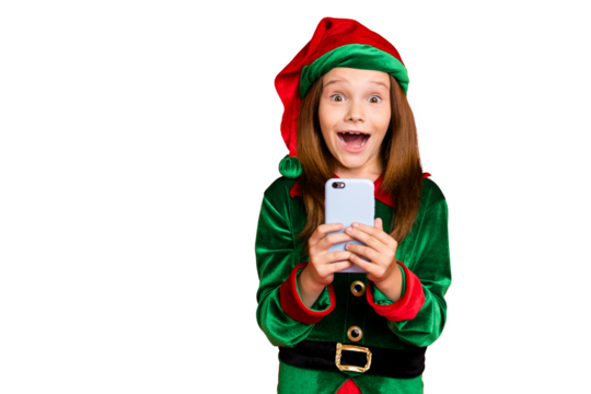 Portrait of shocked elf in green hat cap with long red head screaming wow omg use smartphone get like noel comment wearing elf costume isolated over red background
